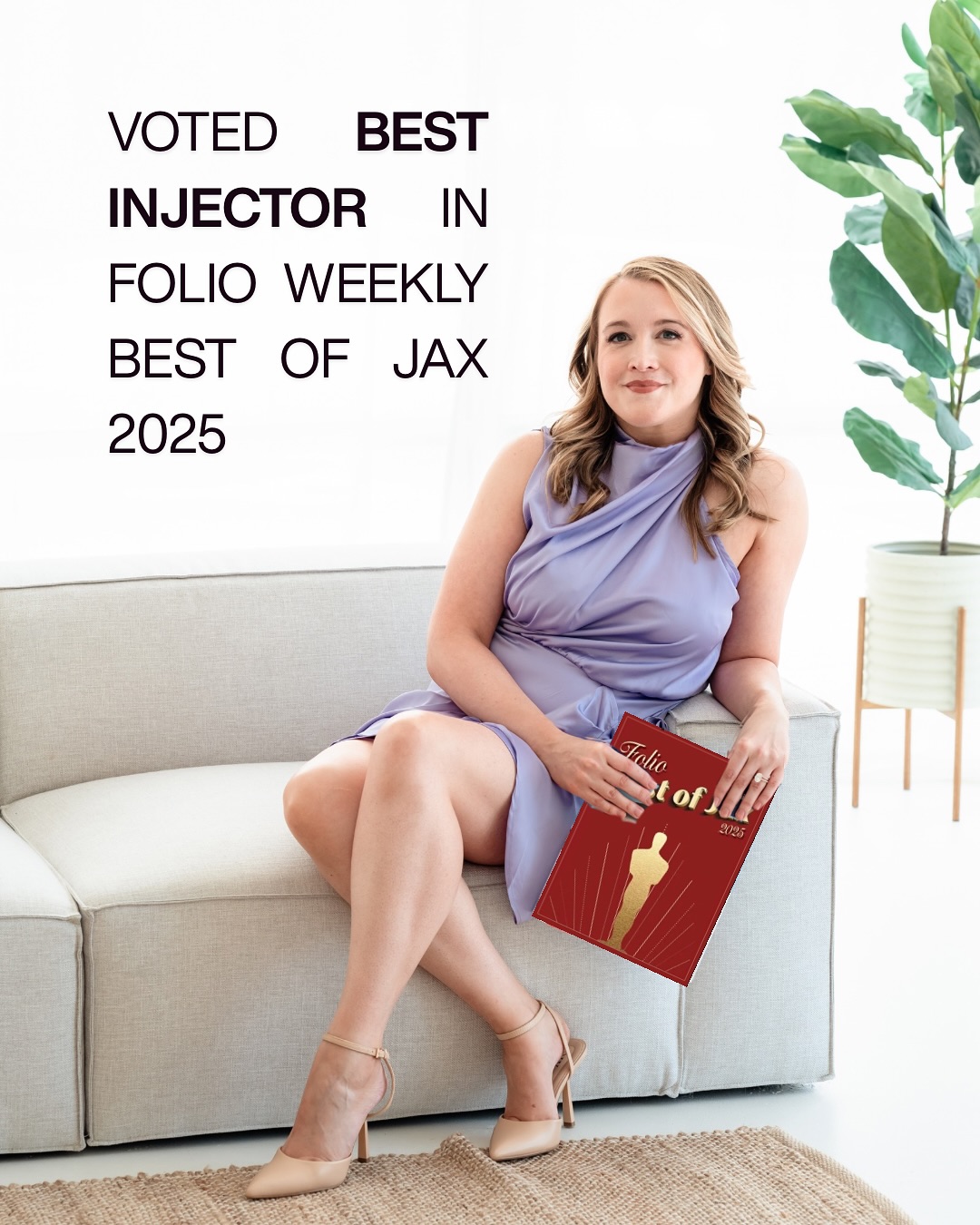 Cayla Nessler holding her Folio Weekly Best of Jax 2025 award